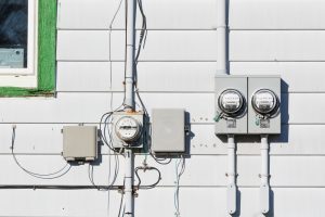 Exterior hydro meter and electrical service upgrade on a residential home with updated electrical infrastructure.